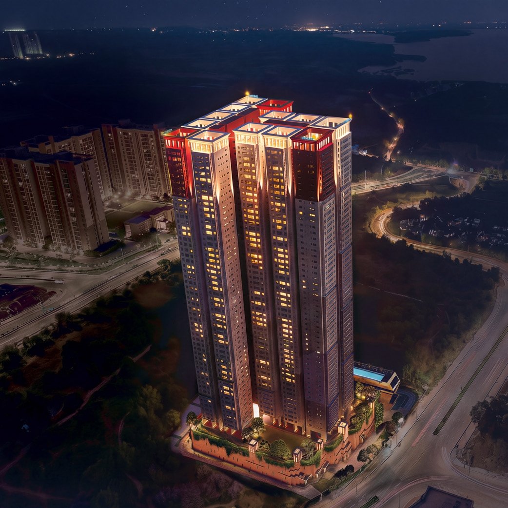 Brigade Barcelona tower illuminated at night above the Kokapet skyline